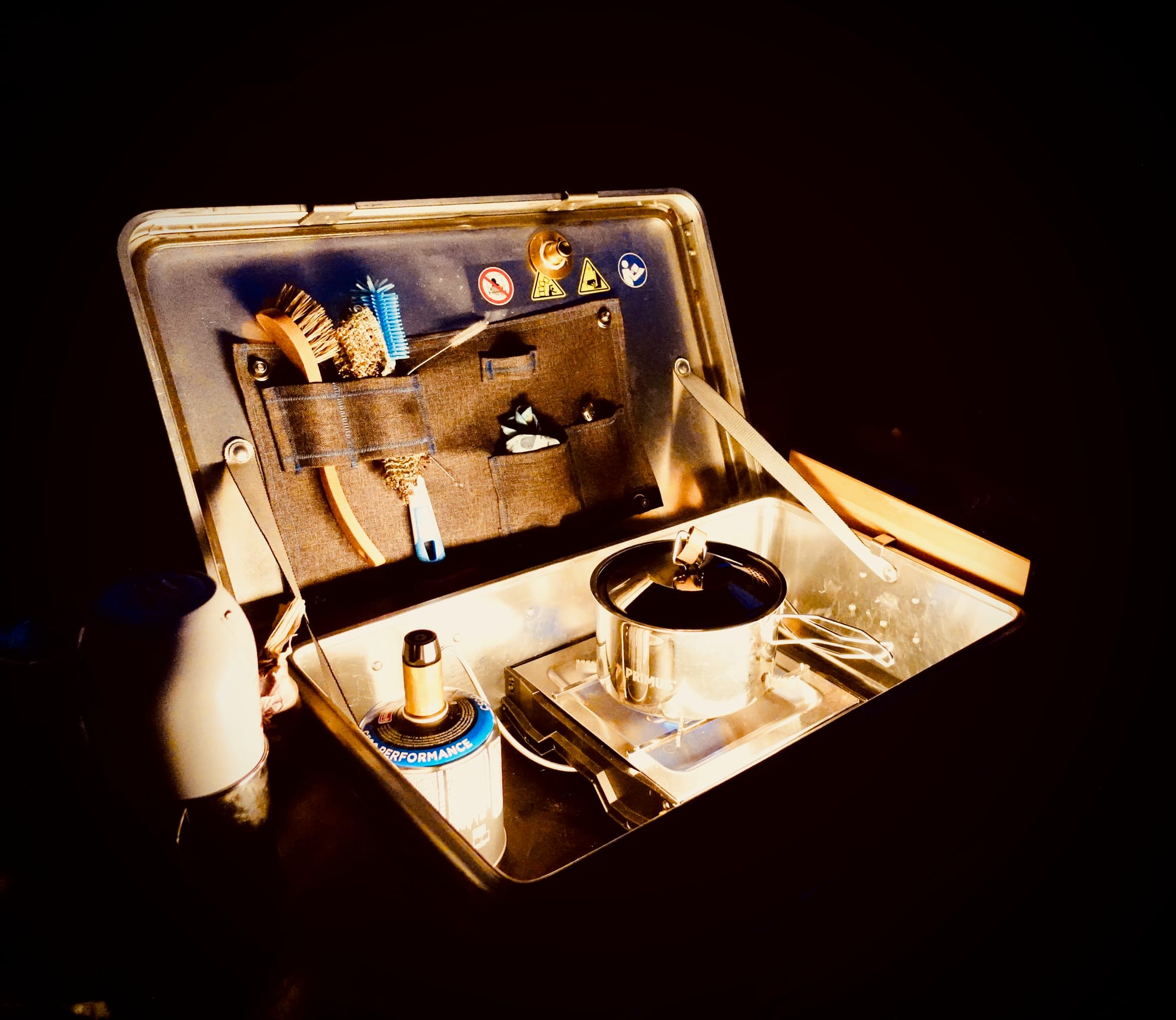 An outdoor kitchen in a box at night