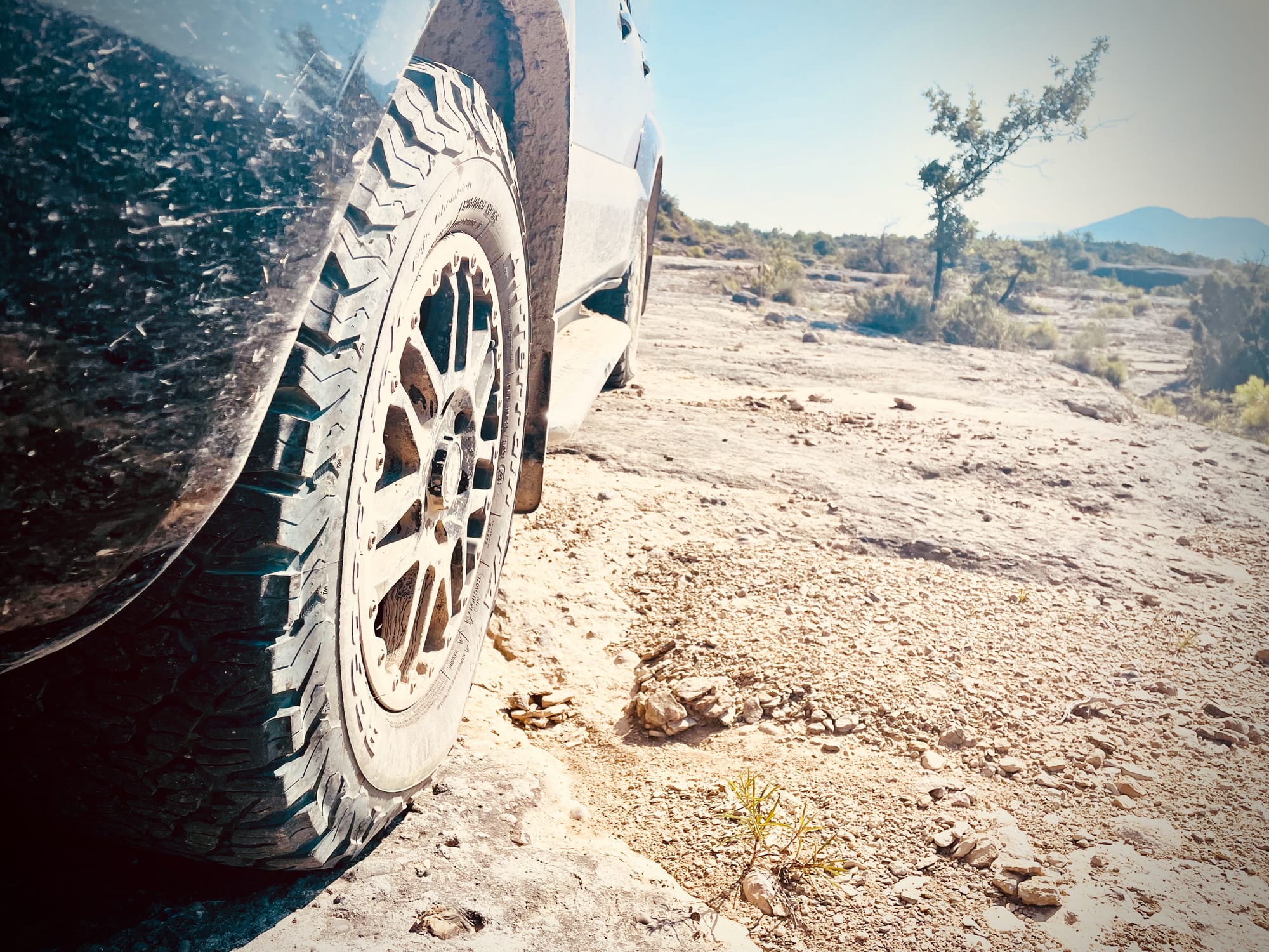 A dirty tyre on rough terrain